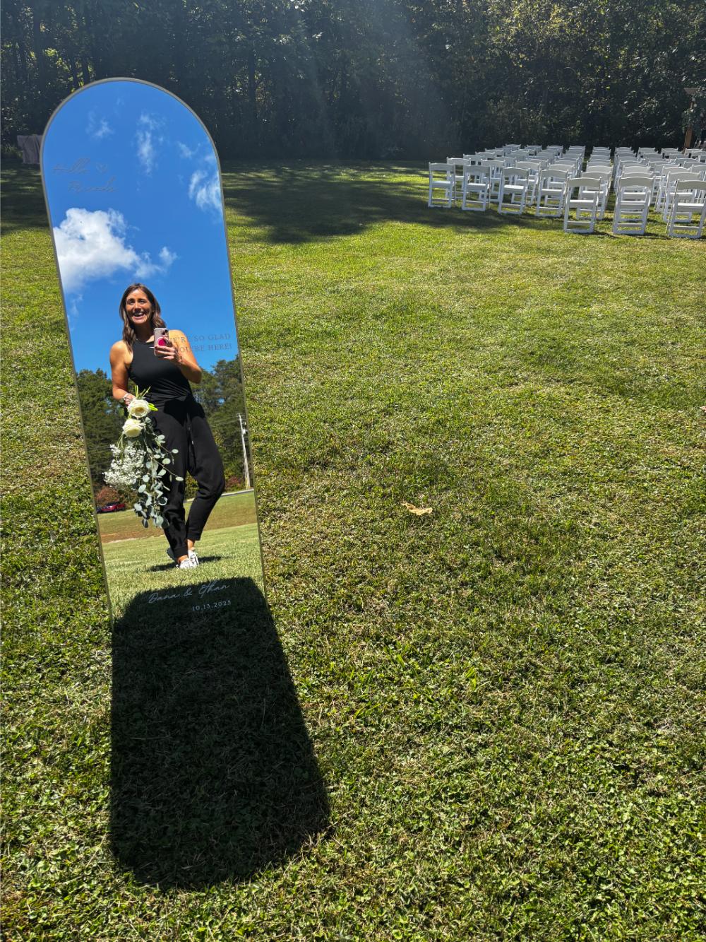 wedding coordinator's reflection in mirror sign