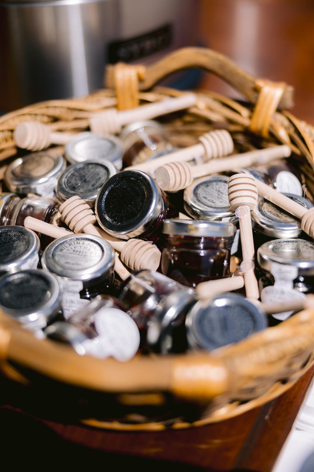 jars of honey in a basket